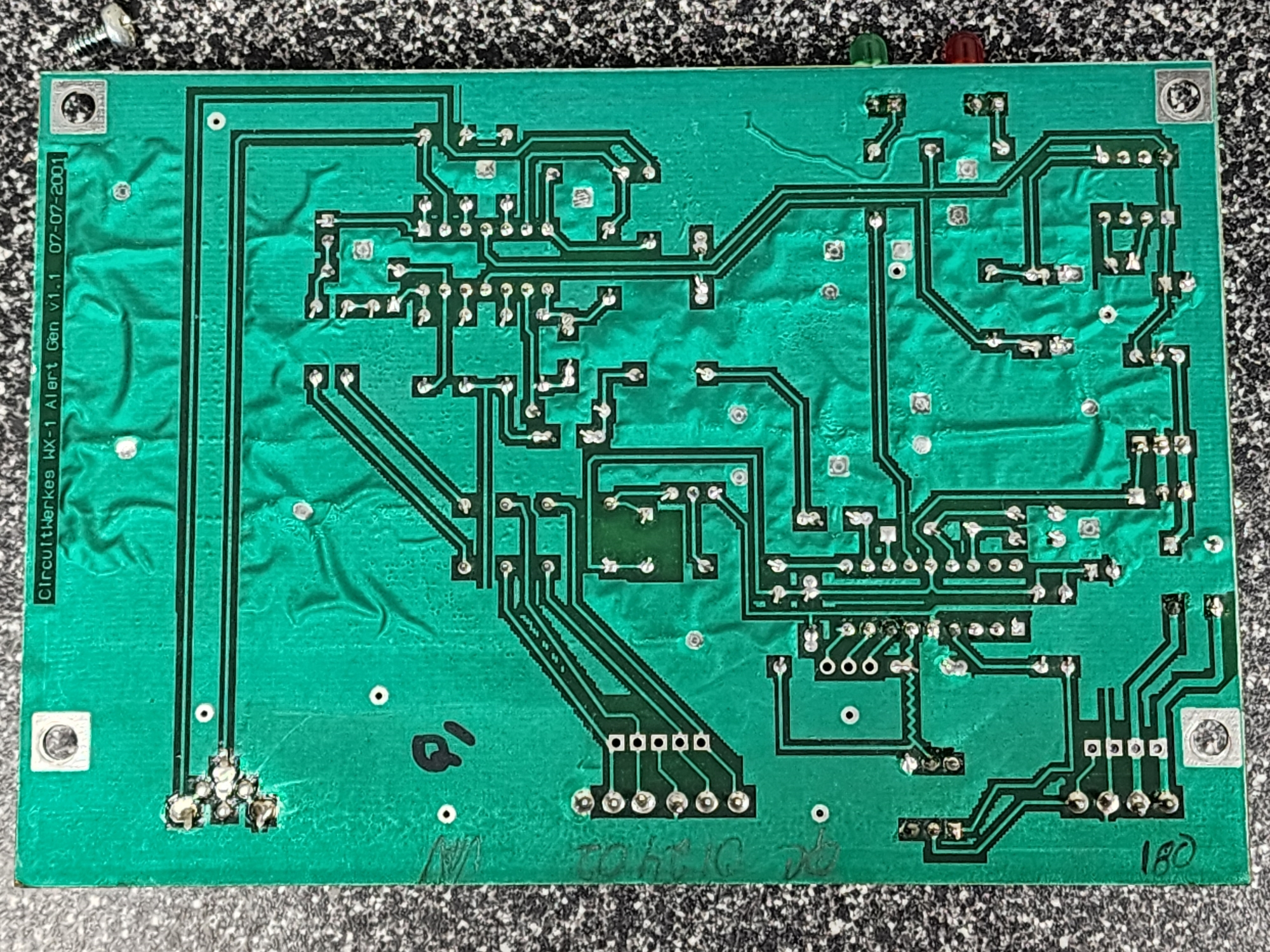 Picture 5: The underside of the circuit board. There are several traces leading to solder points. No components are on this side of the board.